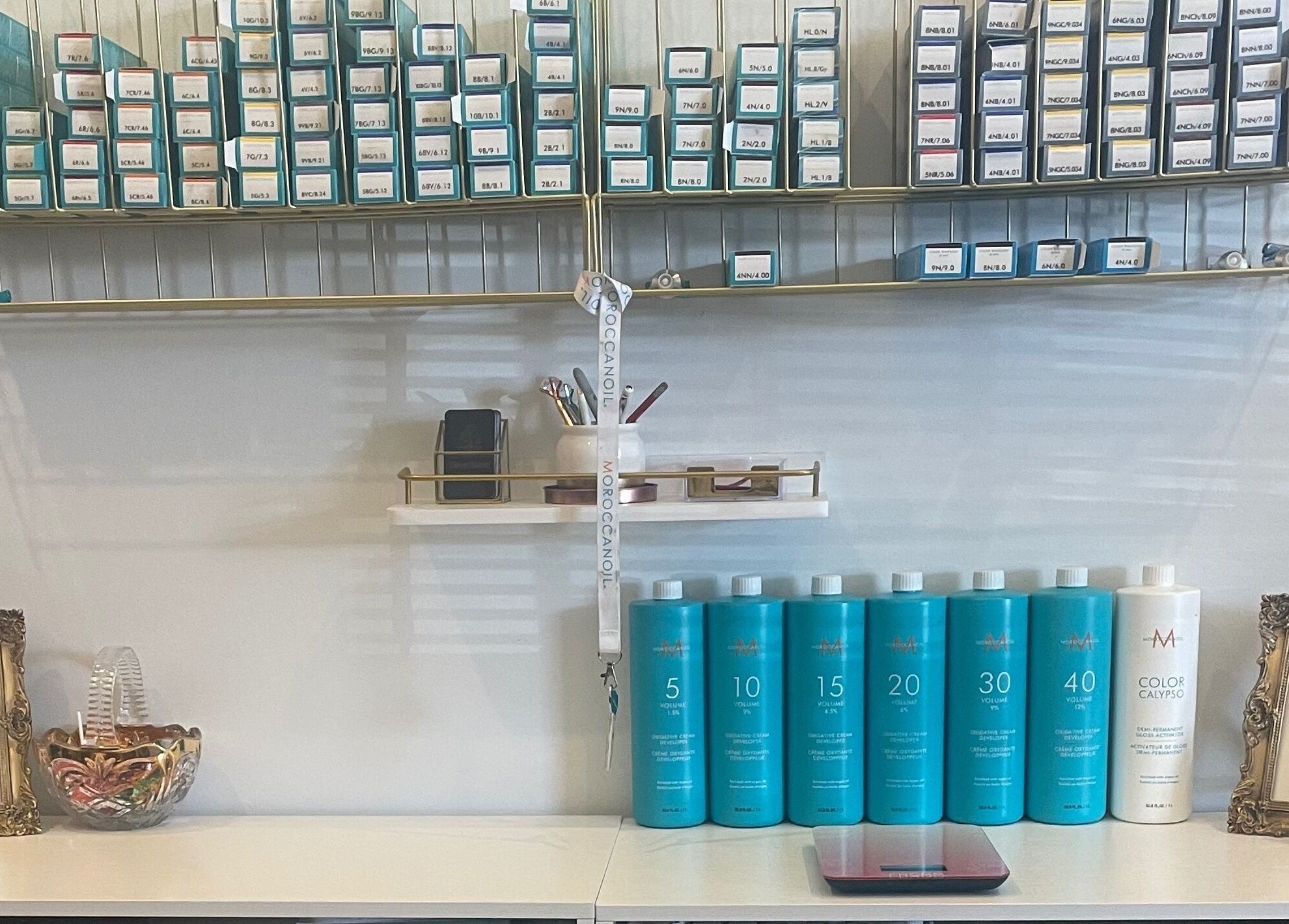 Hair products neatly arranged at Deep Roots Hair Atelier, Riverhead, New York, US, showcasing an inviting salon.