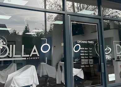 Chic exterior of Dilla Barbershop Urmston, located in Urmston, England, GB, showcasing its modern glass facade.
