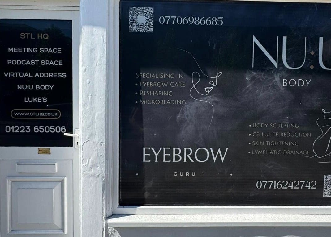 Elegant storefront of Recover with Dora in Cambridge, England, GB, showcasing beauty services and contact info.