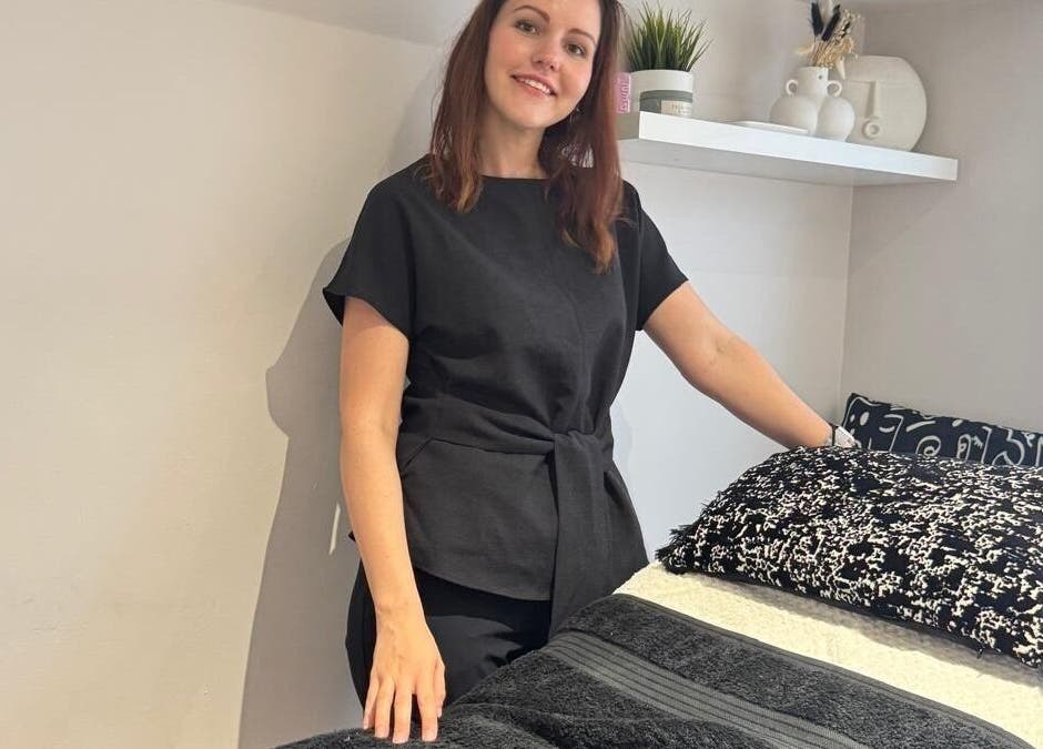 A serene treatment room at Recover with Dora, Cambridge, England, GB featuring a welcoming therapist.