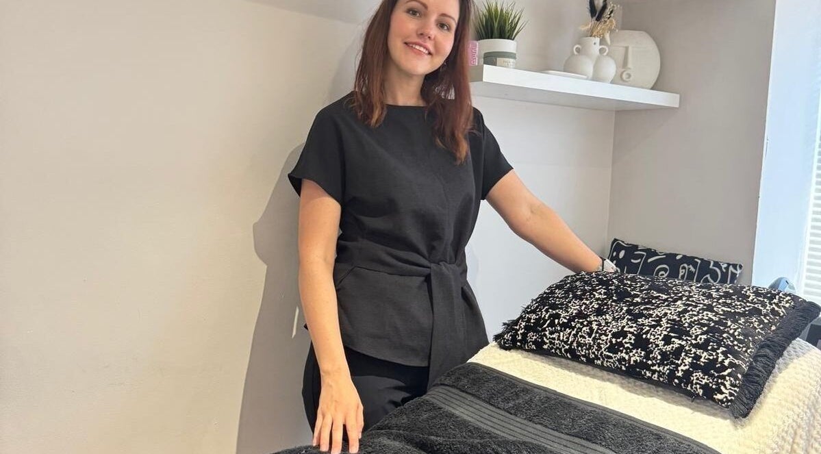 A serene treatment room at Recover with Dora, Cambridge, England, GB featuring a welcoming therapist.