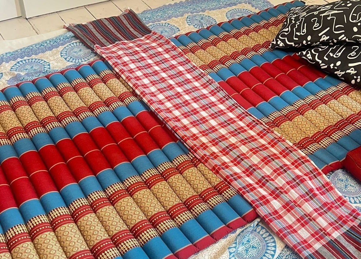 Colorful mats at Recover with Dora, Cambridge, England, GB for relaxation and wellness journey.