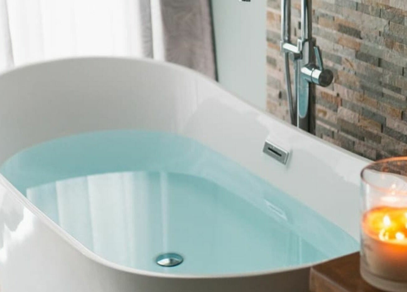 Luxurious bathtub at Reflections Spa Barbados in Bridgetown, Christ Church, BB, with relaxing candles.