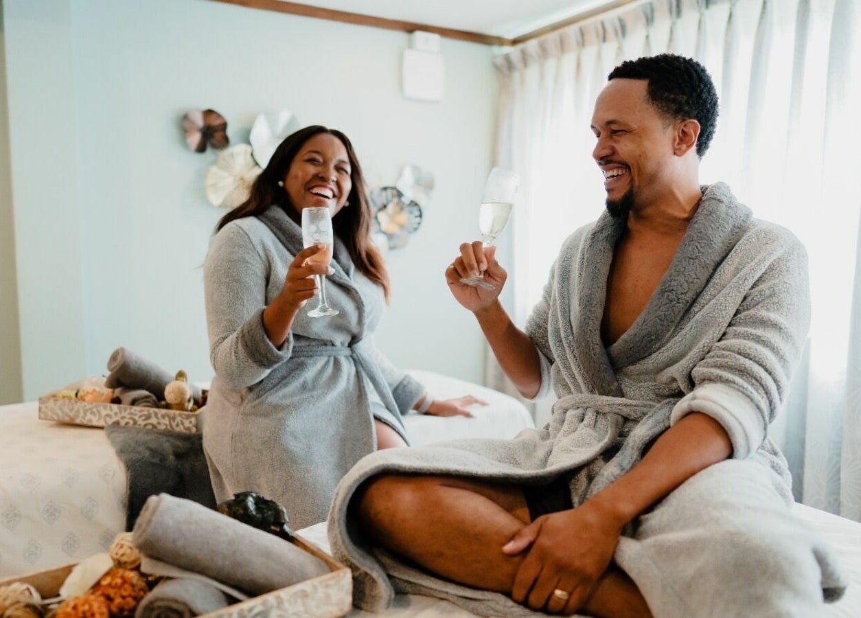 Couple enjoying drinks in robes at REFLECTIONS SPA BARBADOS, Bridgetown, Christ Church, BB.
