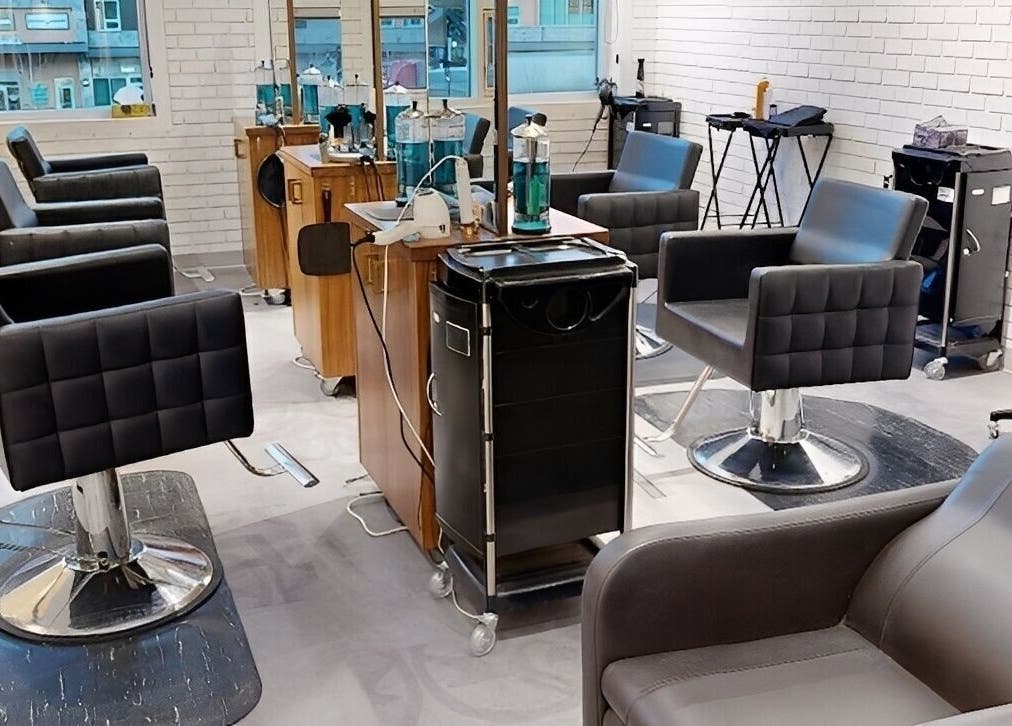 Modern salon interior at The Loft in Canmore, Alberta, CA, featuring sleek styling chairs and mirrors.