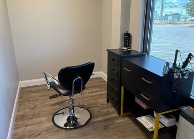 Elegant stylist chair and station at B. Hive Salon, Huntsville, Alabama, US with a scenic view.