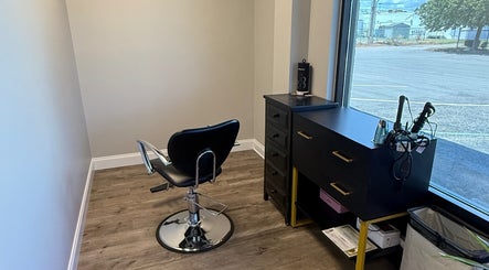 Elegant stylist chair and station at B. Hive Salon, Huntsville, Alabama, US with a scenic view.