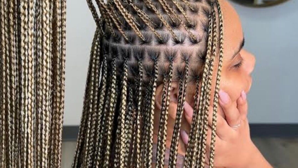 Intricate braided hairstyle at The Braids Lab in Tilbury, England, GB showcasing detailed work.