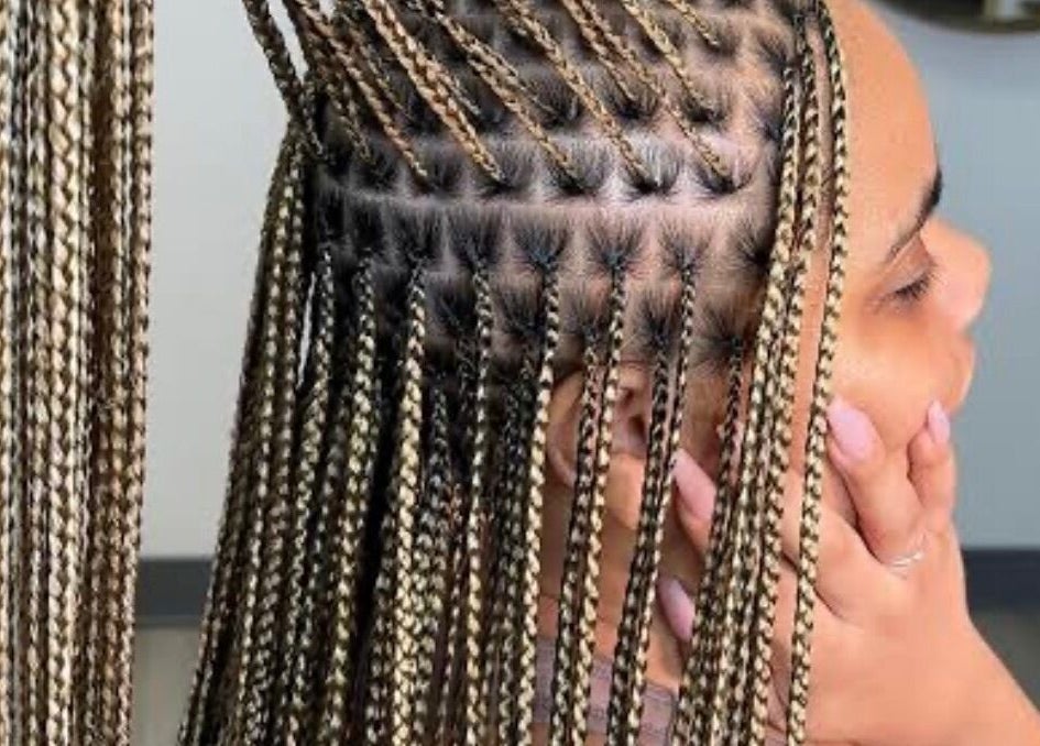 Intricate braided hairstyle at The Braids Lab in Tilbury, England, GB showcasing detailed work.