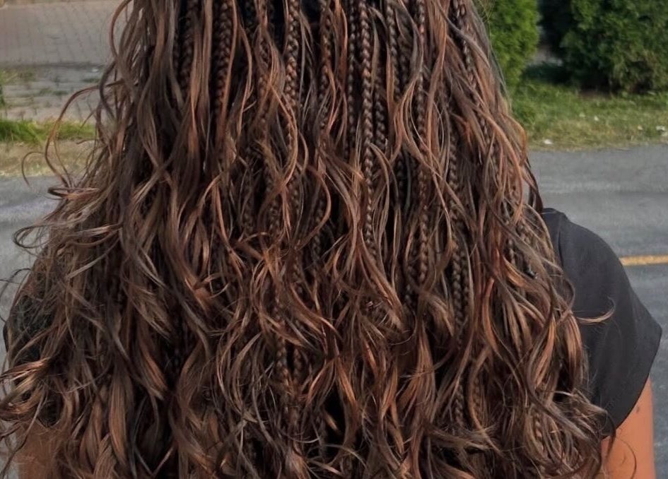 Intricate braids with wavy finish at The Braids Lab, Tilbury, England, GB.