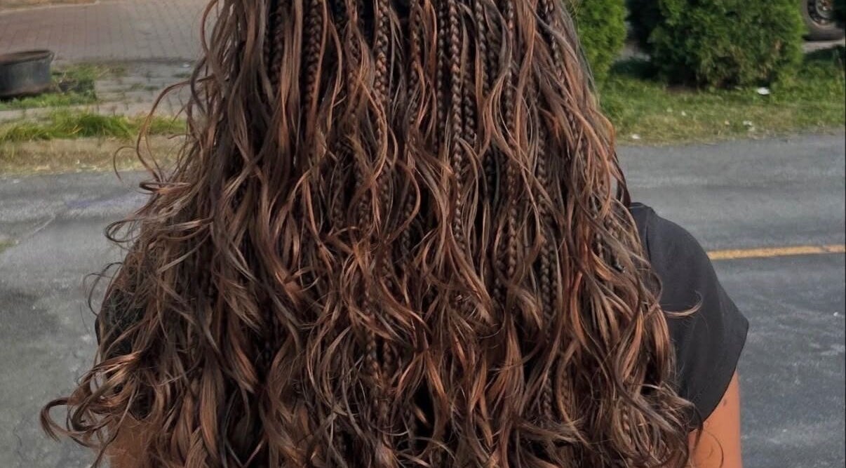 Intricate braids with wavy finish at The Braids Lab, Tilbury, England, GB.