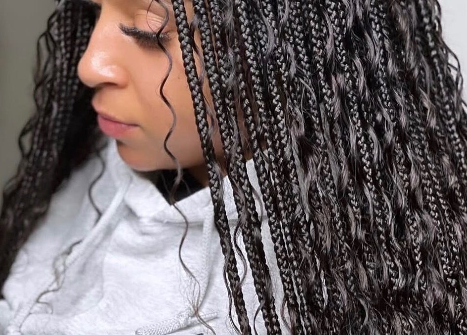 Detailed braids from The Braids Lab, Tilbury, England, GB, showcasing sleek styling.