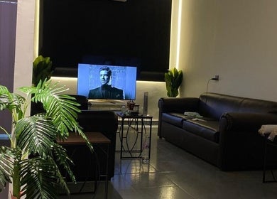 Cozy lounge area with modern sofas at Buzz Stop, Taif, Makkah Province, SA, featuring a stylish decor.