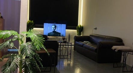 Cozy lounge area with modern sofas at Buzz Stop, Taif, Makkah Province, SA, featuring a stylish decor.