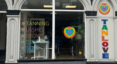 Colorful facade at Angel Aesthetics in Stourbridge, England, showcasing tanning, lashes, and more services.