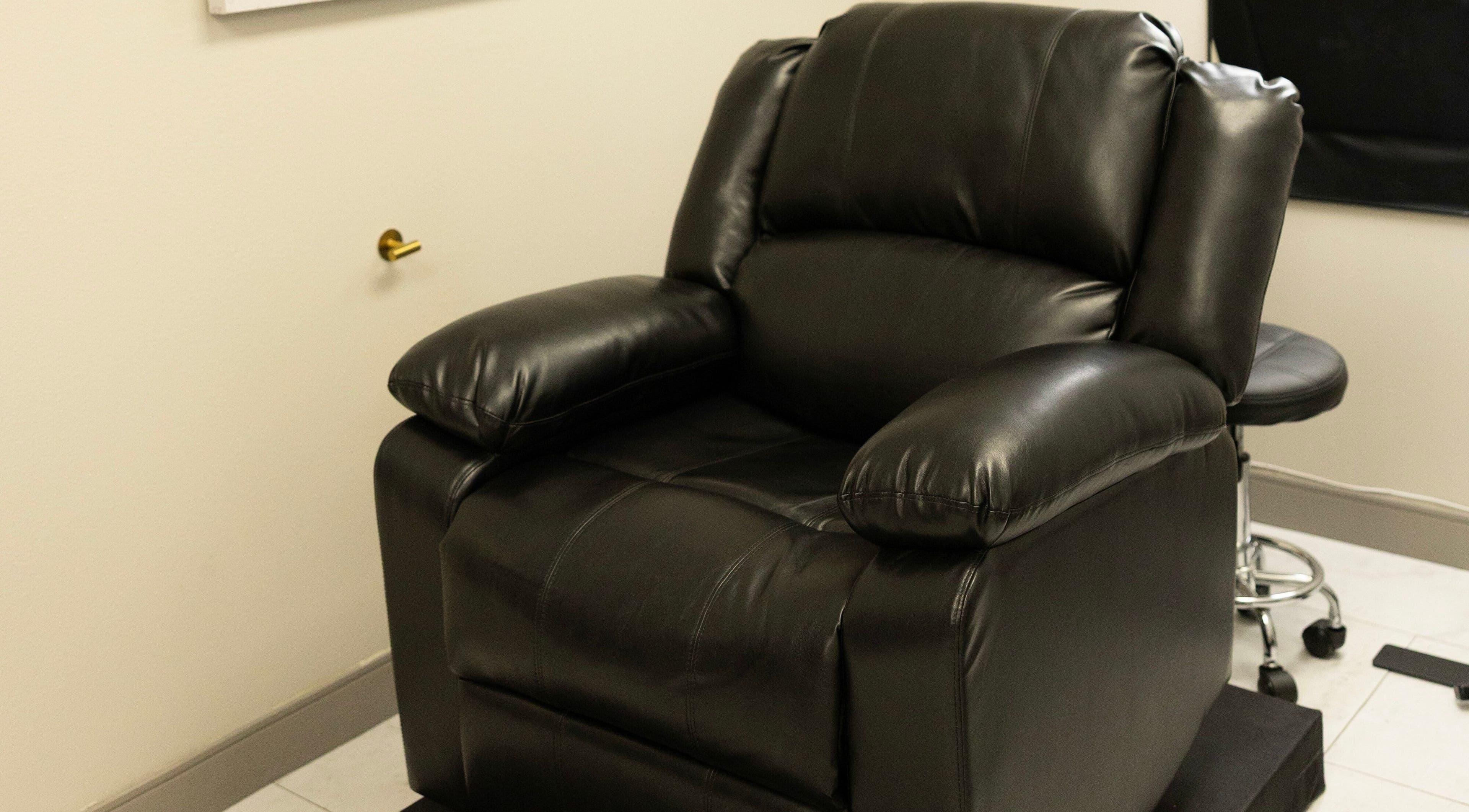 Luxury black leather chair at The LVSH Salon, Las Vegas, Nevada, US. Perfect for relaxation and treatments.