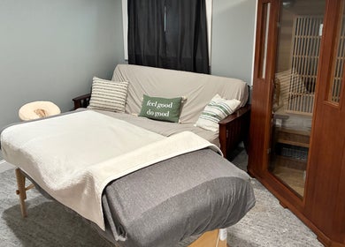 Relaxing treatment room at It Is Well, Burlington, Wisconsin, US, featuring massage bed and cozy decor.