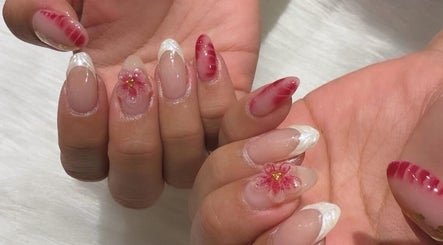 Beautiful floral nail art at Divine Nails Studio, WA, Western Australia, AU, showcasing intricate red designs.