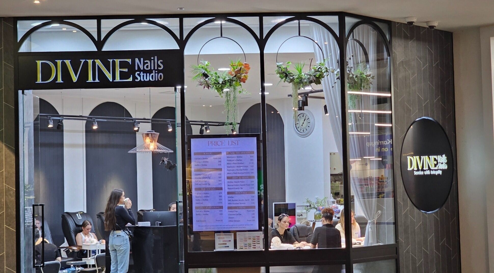 Entrance of Divine Nails Studio in WA, Western Australia, AU showcasing elegant decor and pricing list.