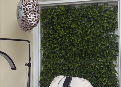 Relaxing setting at Kiss My Lash, Nassau, New Providence, BS, featuring lush greenery and stylish decor.