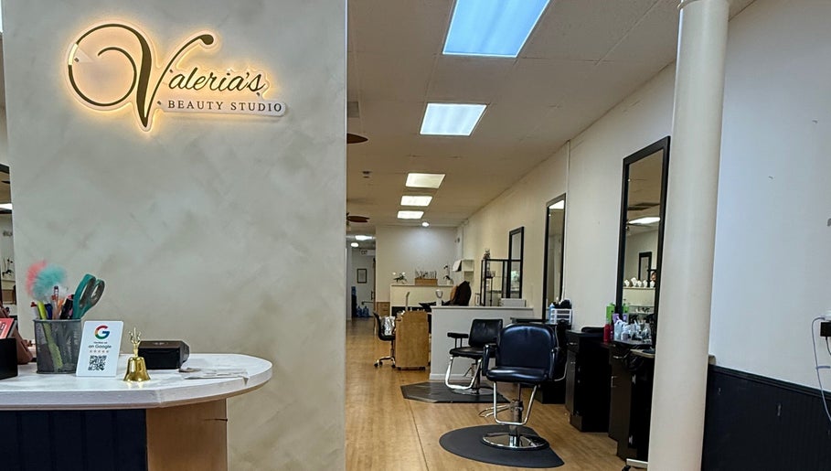 Inside Valeria’s Beauty Studio in Kennesaw, Georgia, showcasing stylish salon chairs and decor.