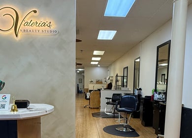 Inside Valeria’s Beauty Studio in Kennesaw, Georgia, showcasing stylish salon chairs and decor.