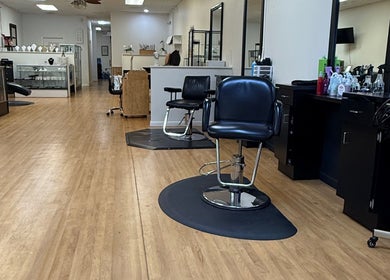 Bright and modern salon interior at Valeria's Beauty Studio, Kennesaw, Georgia, US featuring styling chairs.