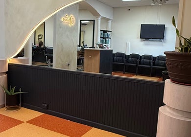 Modern interior of Valeria’s Beauty Studio in Kennesaw, Georgia featuring stylish seating and decor.