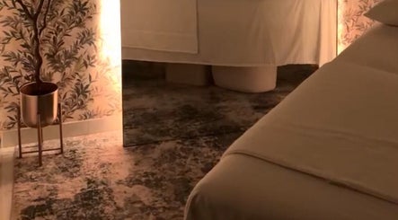 Peaceful massage room at Shalom Massage, Mcallen, Texas, US, with serene decor and warm lighting.