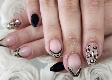 Elegant leopard print nails at L'amitié, Flemington, New Jersey, US. Perfectly crafted nail designs.