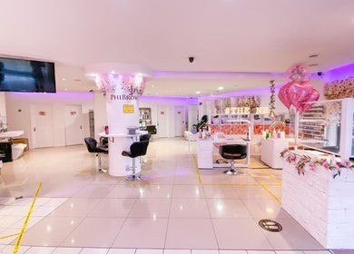 Interior of The Nails Boutique, Kingston Upon Thames, England, GB, showcasing elegant seating and décor.