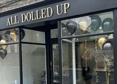 Elegant salon facade of J c hairstylist with balloons, located in Stowmarket, England, GB.