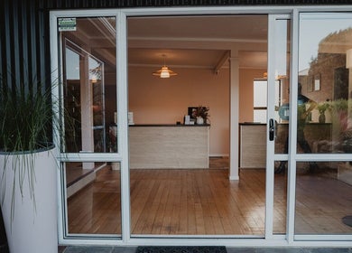 Entrance of Pure Day Spa in Kerikeri, Northland, NZ showing modern decor and inviting atmosphere.