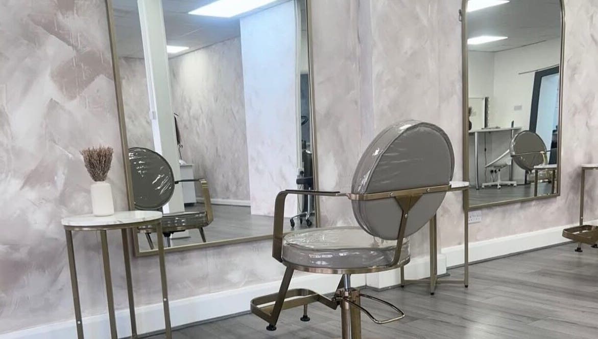 Modern hair salon interior at LuxeLocksBySeren in Connah's Quay, Wales, GB, featuring chic chairs and mirrors.
