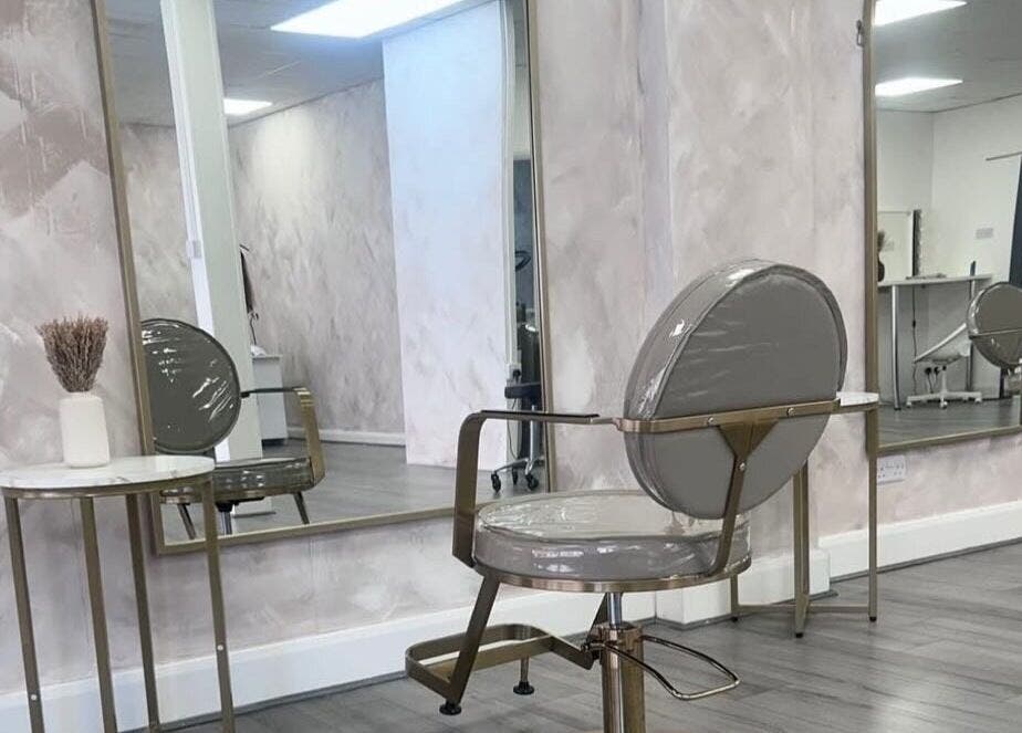 Modern hair salon interior at LuxeLocksBySeren in Connah's Quay, Wales, GB, featuring chic chairs and mirrors.