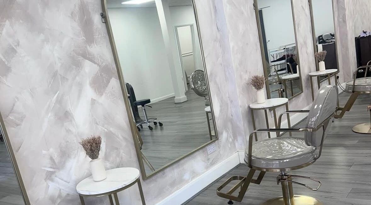 Chic salon interior at LuxeLocksBySeren in Connah's Quay, Wales, GB, featuring stylish mirrors and seating.