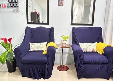 Cozy waiting area with lush plants at Natural24 Beauty Studio, Randburg, Gauteng, ZA.