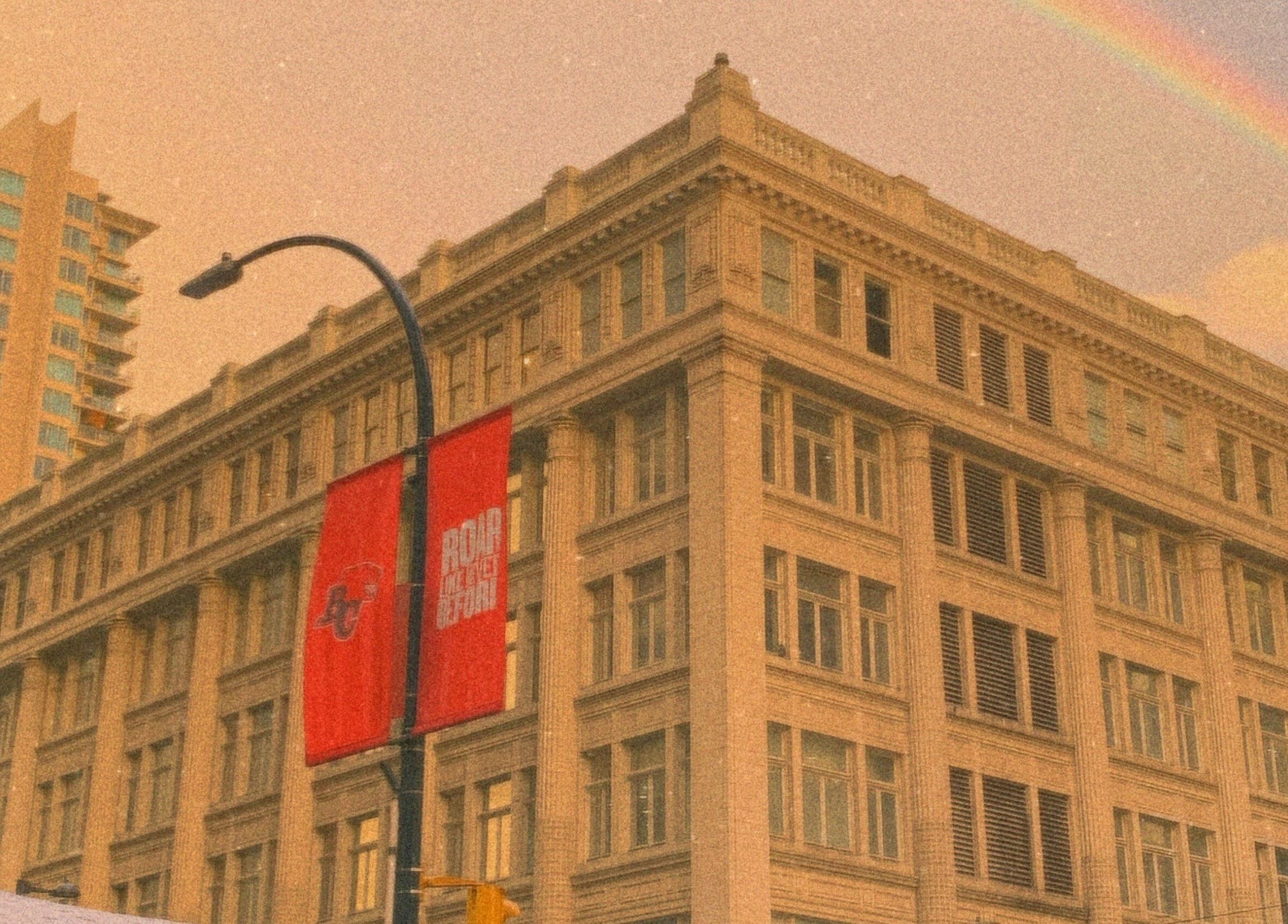 Historic building near パリ美容室 in Shinjuku City, Tokyo, JP beneath a vibrant rainbow.