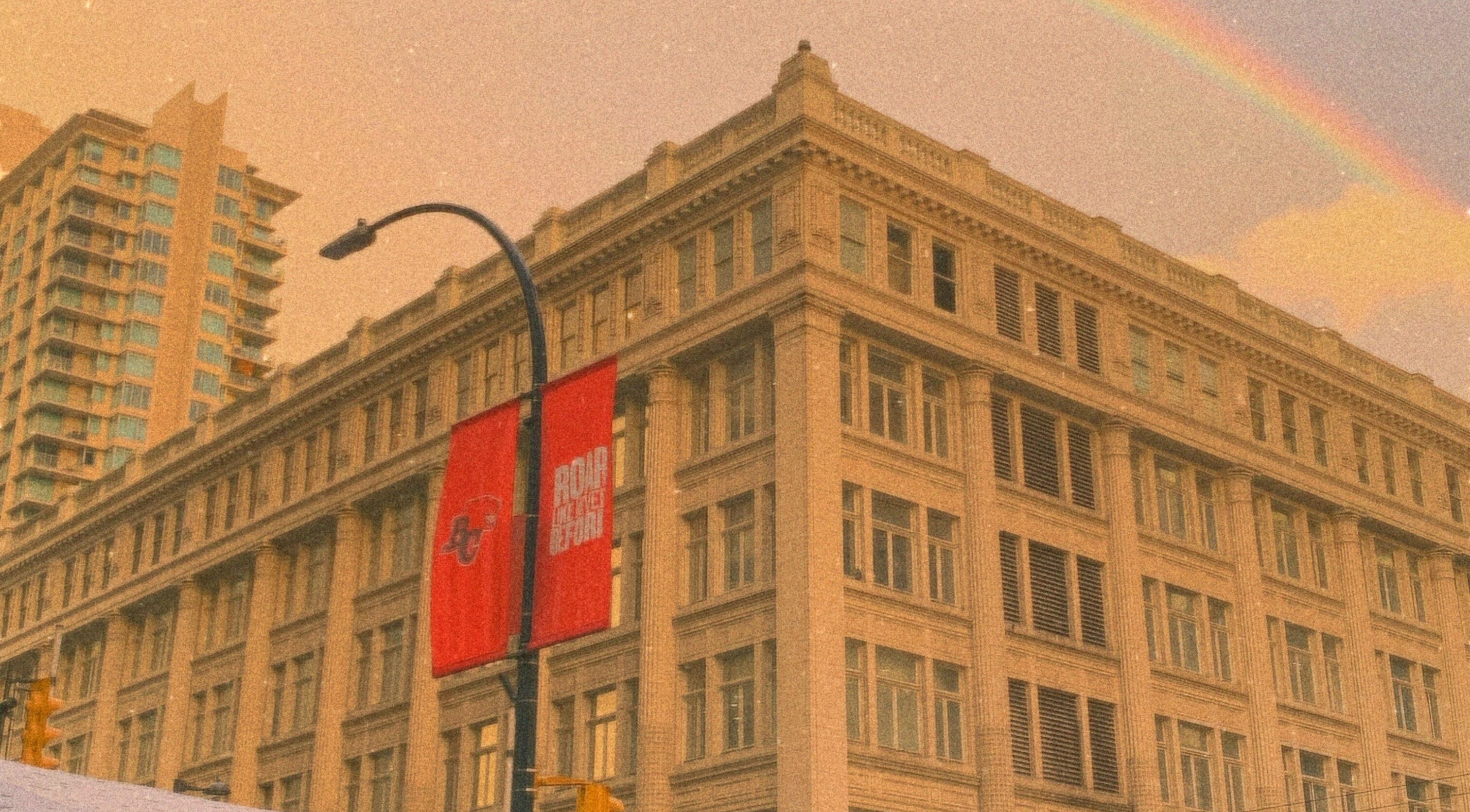 Historic building near パリ美容室 in Shinjuku City, Tokyo, JP beneath a vibrant rainbow.