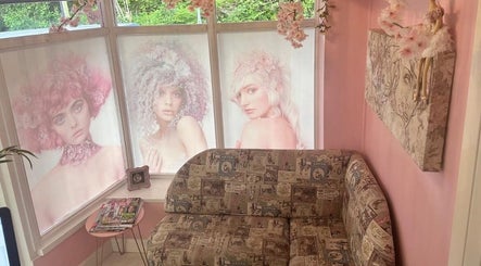 Elegant seating area at Hair by Janine at Shelley Lane Salon, Aberkenfig, Wales, GB with chic decor and style art.