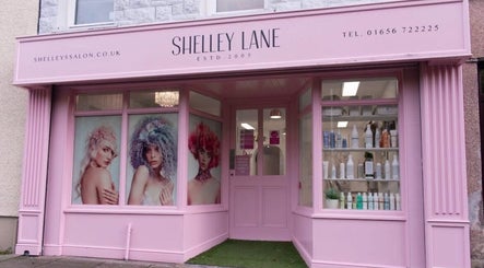 Exterior of Hair by Janine at Shelley Lane Salon, Aberkenfig, Wales, GB, showcasing stylish window displays.