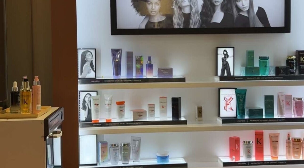 Kerastase products on lit shelves at Areej Beauty Spa, Seeb, Muscat Governorate, OM.
