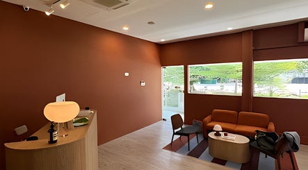 Elegant interior of Reverie On Hill in Singapore, featuring a warm-toned lounge with modern decor.