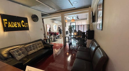 Interior view of Fade’N Cut Barber Shop in Paranaque City, Metro Manila, PH, featuring modern seating and decor.