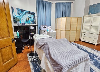 Tranquil massage room at Centered Wellness Clinic and Spa in Wentzville, Missouri, US, with soothing decor.