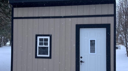 Front view of AJ Nails venue in Oneida, Illinois, US with beige exterior and snow scenery.