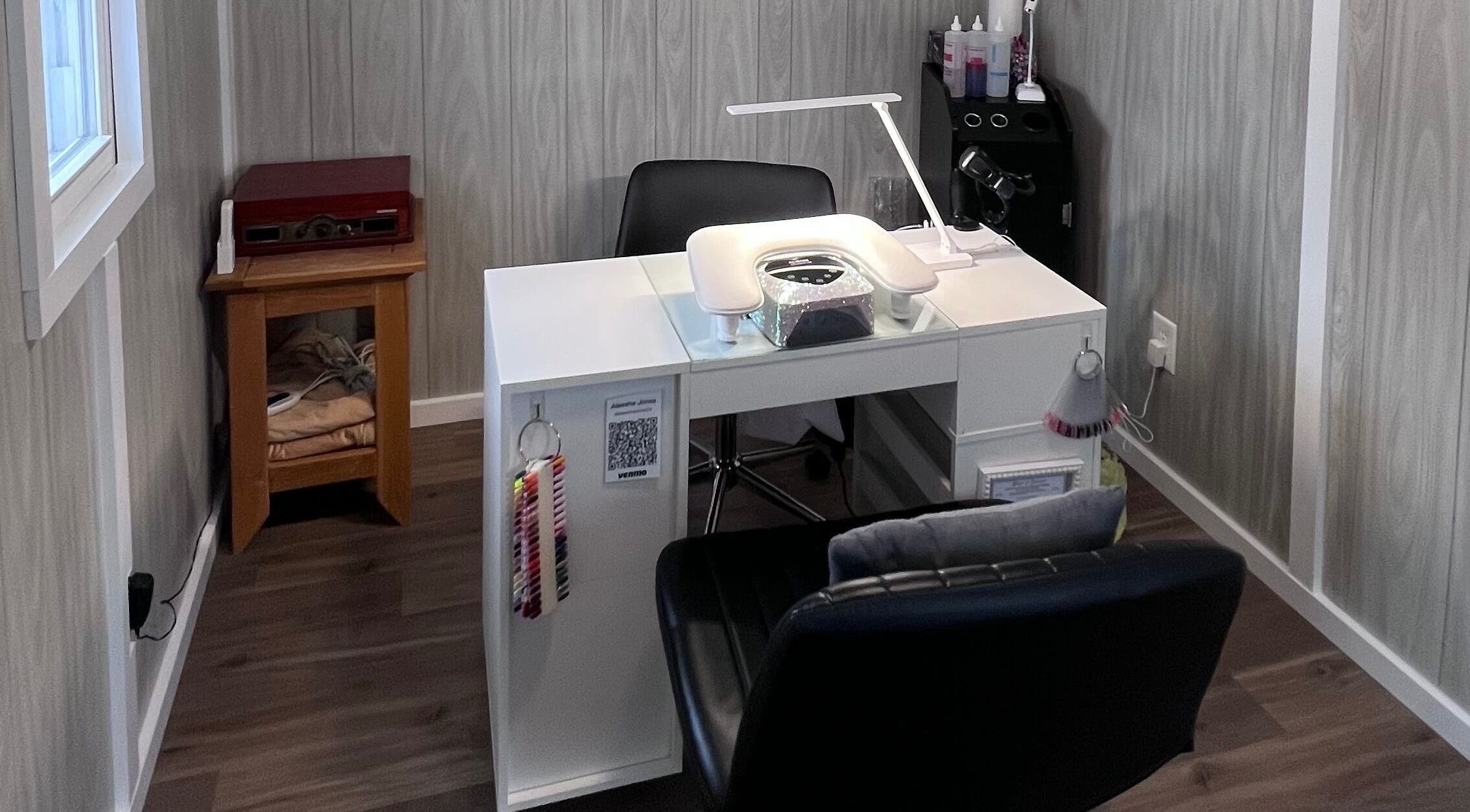 Chic nail station at AJ Nails, Oneida, Illinois, US, featuring modern decor and comfortable seating.