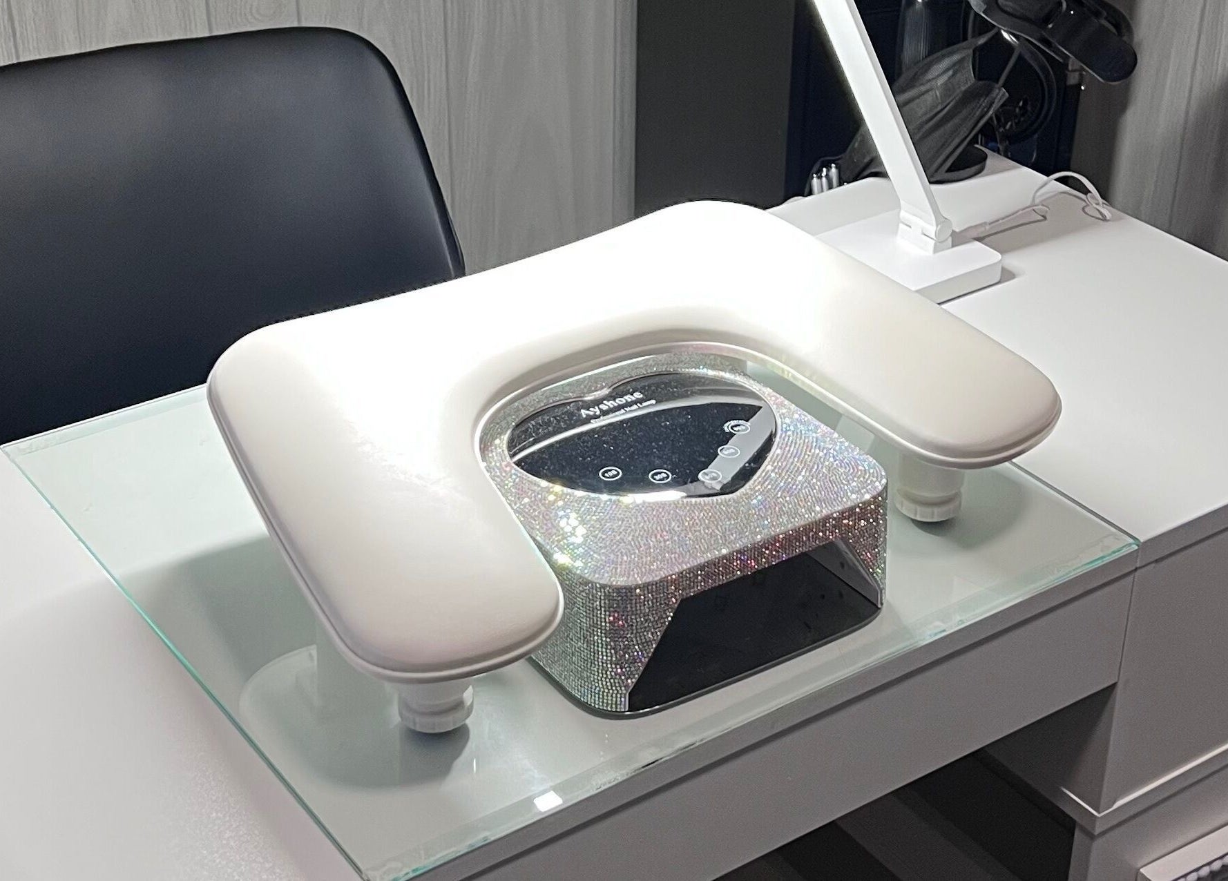 Elegant nail station at AJ Nails, Oneida, Illinois, US with a sleek chair and glittering equipment.