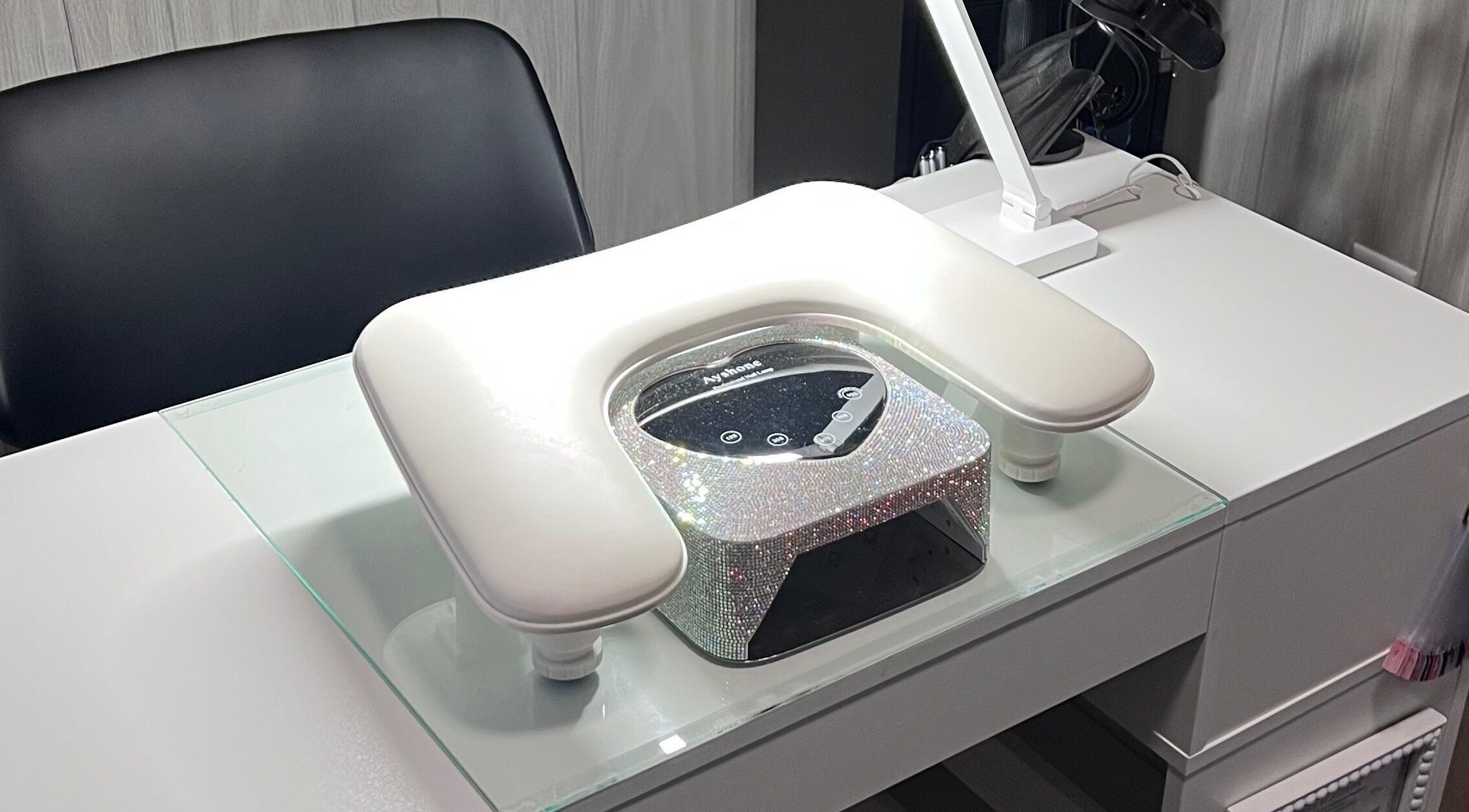 Elegant nail station at AJ Nails, Oneida, Illinois, US with a sleek chair and glittering equipment.