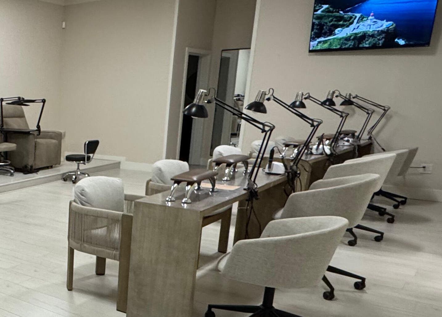 Elegant interior of Amitie Beaute Bar, a salon in Los Angeles, California, US, featuring cozy nail stations.